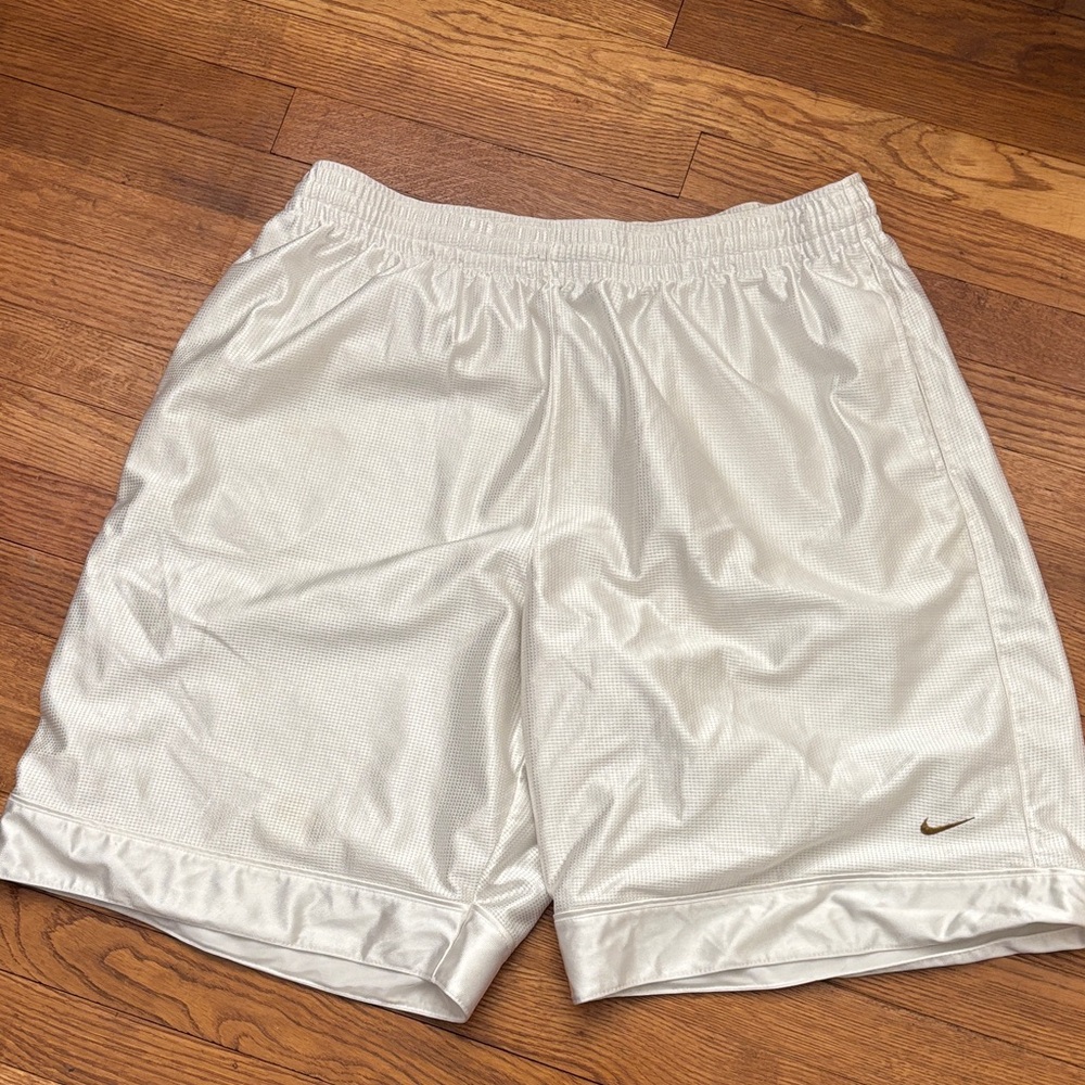 Nike Men's White Athletic Shorts with Subtle Metallic Swoosh